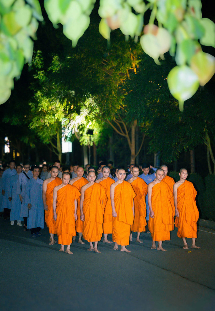 Monks of Ba Vang Pagoda lead Buddhists in walking meditation.