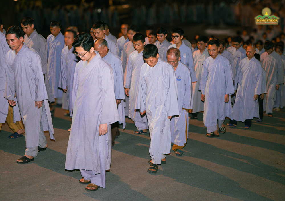 Buddhists of Ba Vang Pagoda practice paying attention to every step.