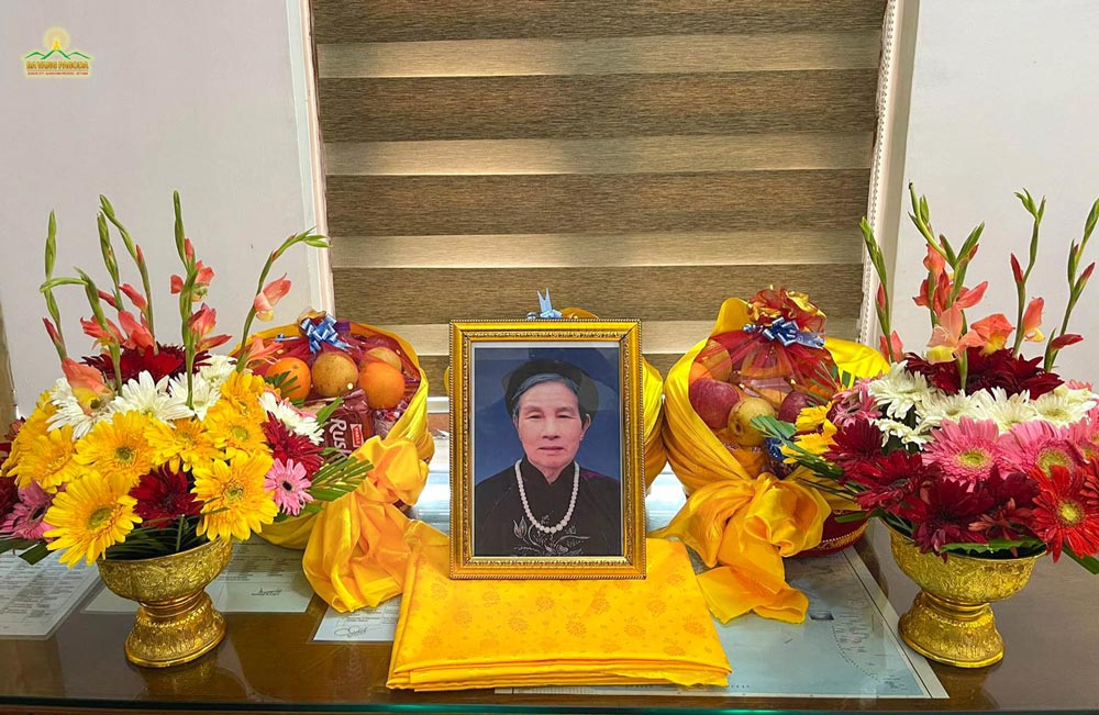 The portrait of Thay Thich Truc Thai Minhs mother was placed in the reception hall of Bodhgaya, where the monks chanted sutras and prayed for her.