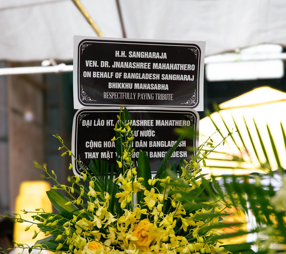 Upon receiving the news of Mrs. Ngo Thi Sacs passing, Most Venerable Dr. Jnanashree Mahathero, 13th Sangharaja of Bangladesh, although unable to personally attend the funeral due to distance and numerous ecclesiastic religious duties, sent a wreath, offered prayers, and extended his condolences to the bereaved family.