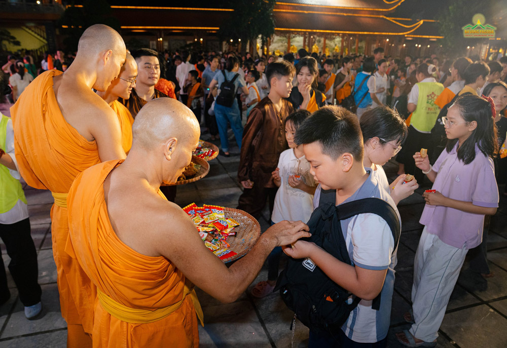 Monks gave candies and cakes to kids