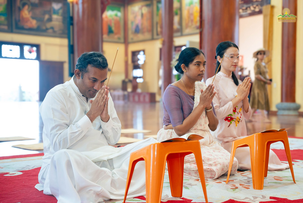 The Ambassador and Minister Counsellor reverently joined hands, following the monks chanting