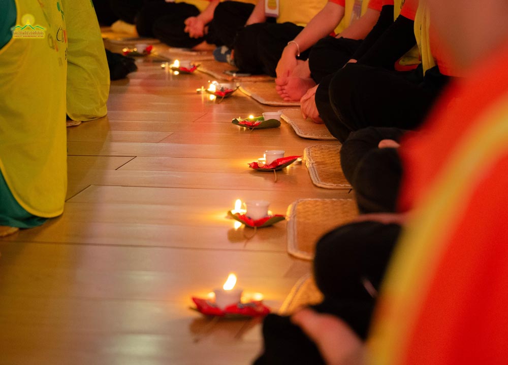 Small candles cast a warm, gentle glow across the stillness