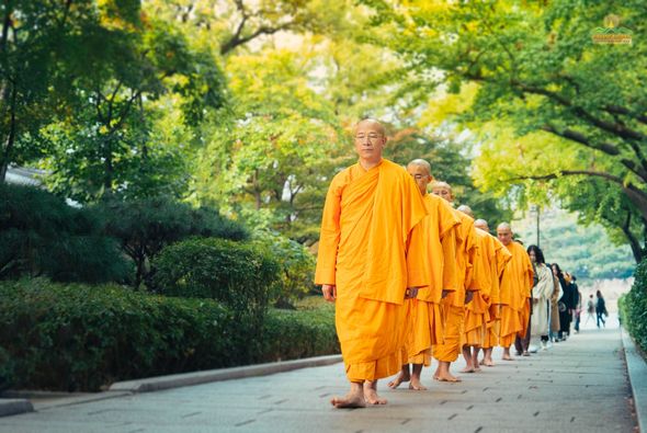 The silent walking meditation steps of Thay, the monks, and Buddhists along the way from the Blue House to the National Folk Museum of Korea, Seoul.
