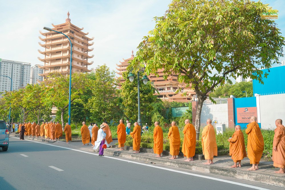 The orange-clad robes of venerable monks adorned the path around Minh Dang Quang Pagoda.