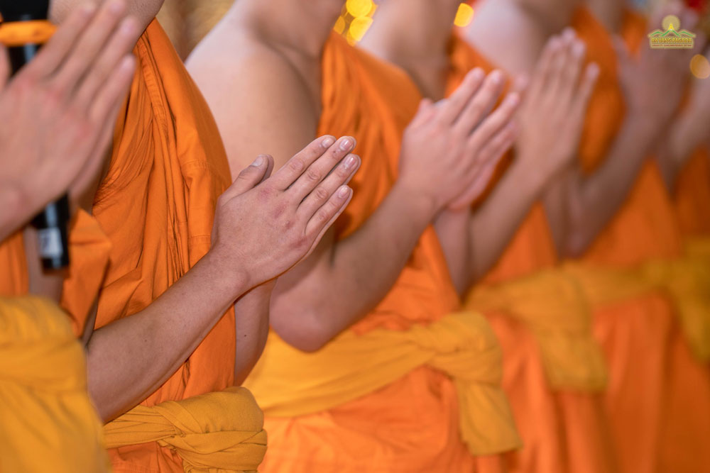 Monks solemnly joined hands in the ceremony.