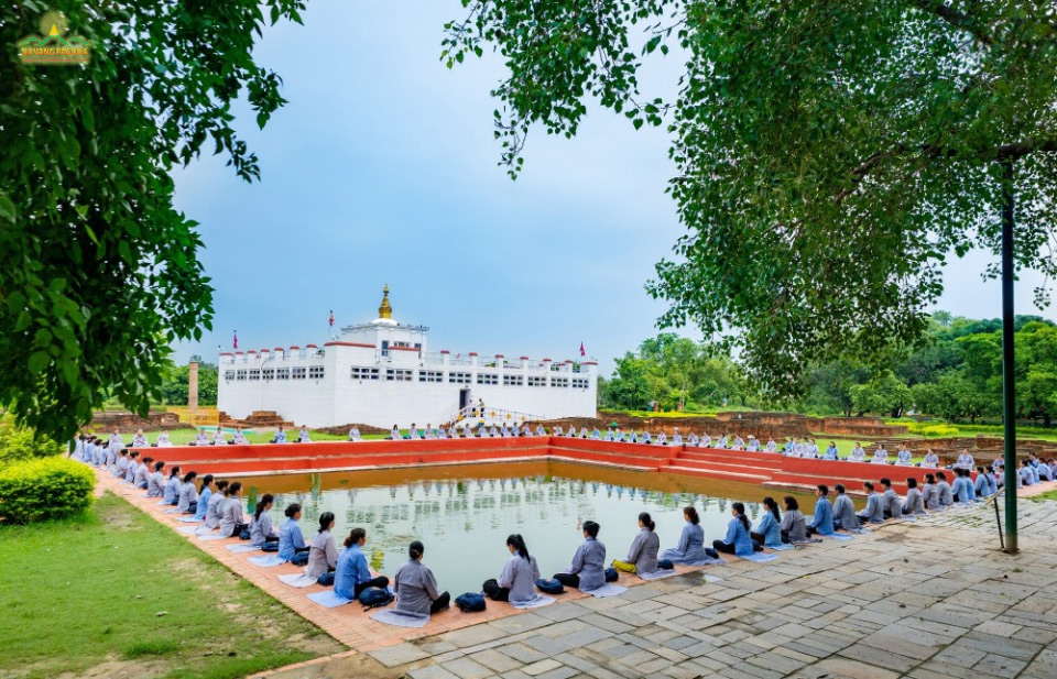 Lay Buddhists practiced meditation around the holy pond.