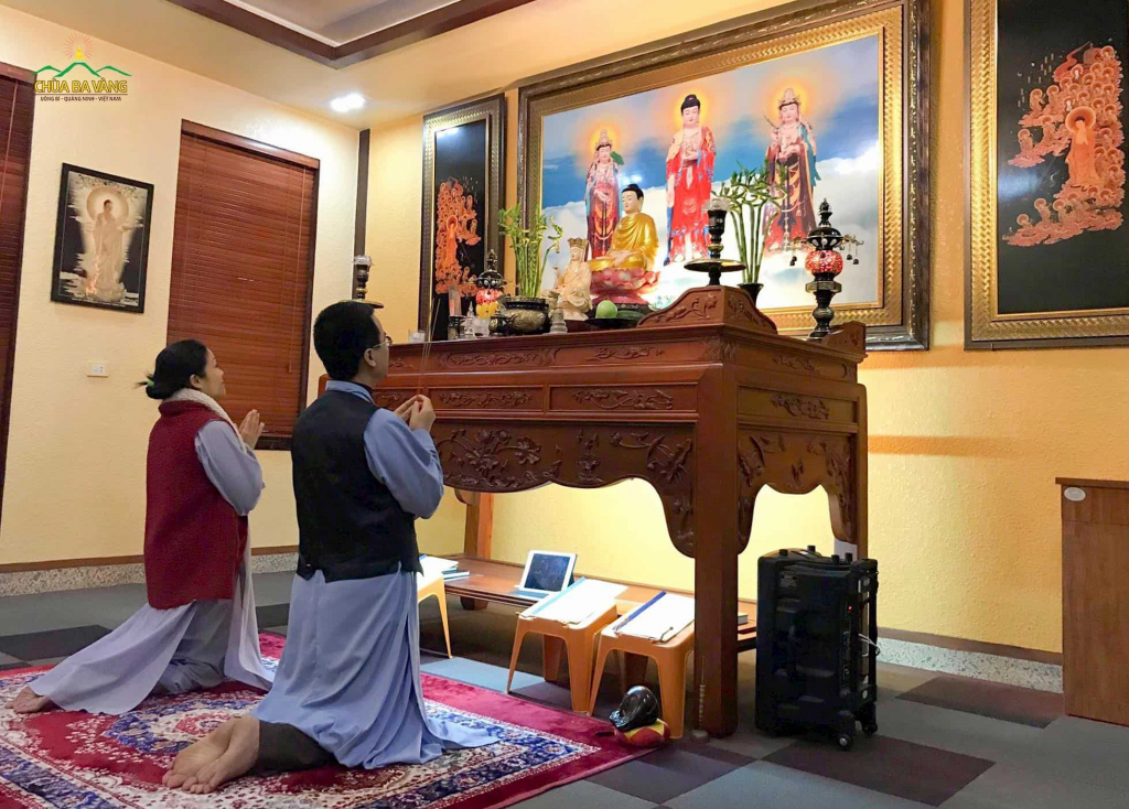 Lay Buddhists of Ba Vang Pagoda reciting the Sutras and praying at home for the end of coronavirus.