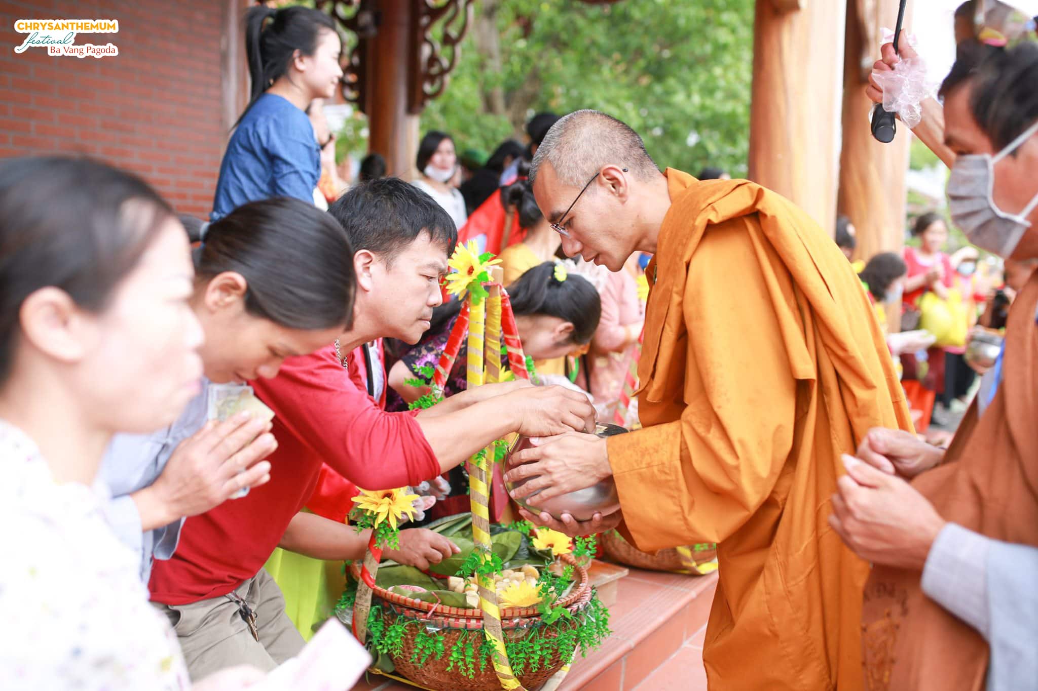 Monks receiving alms from Buddhists