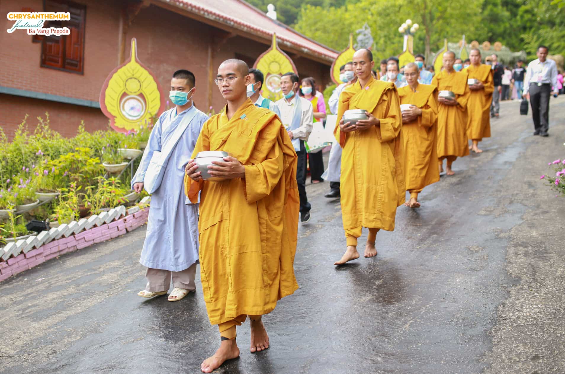 monks-walking-mindfully-on-their-alms-round-in-the-campus-of-ba-vang-pagoda