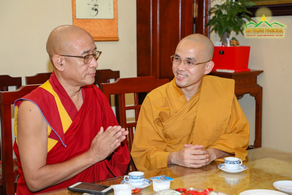 Rinpoche sharing stories with a Venerable at Ba Vang Pagoda