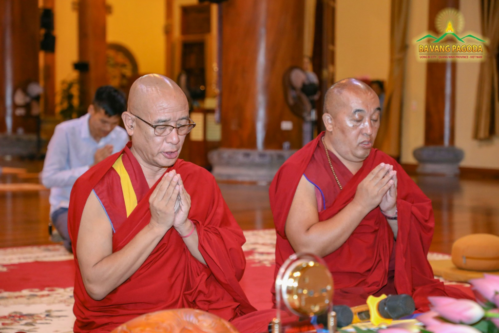 Rinpoche and monks chanting sutras in the Main Hall of the Pagoda