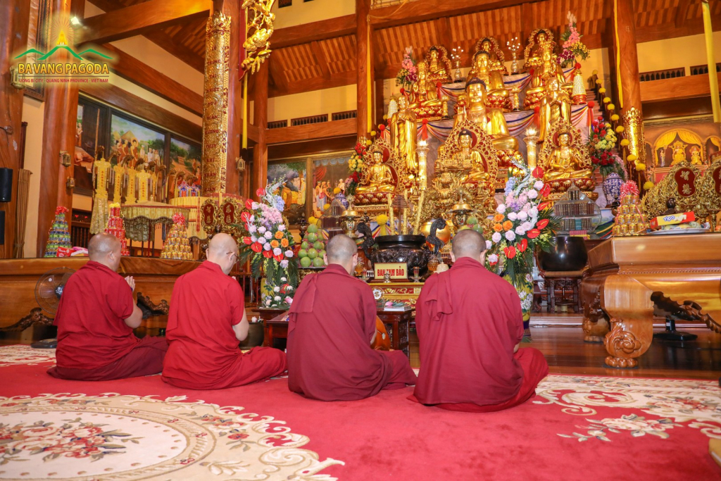 Rinpoche and monks chanting sutras in the Main Hall of the Pagoda