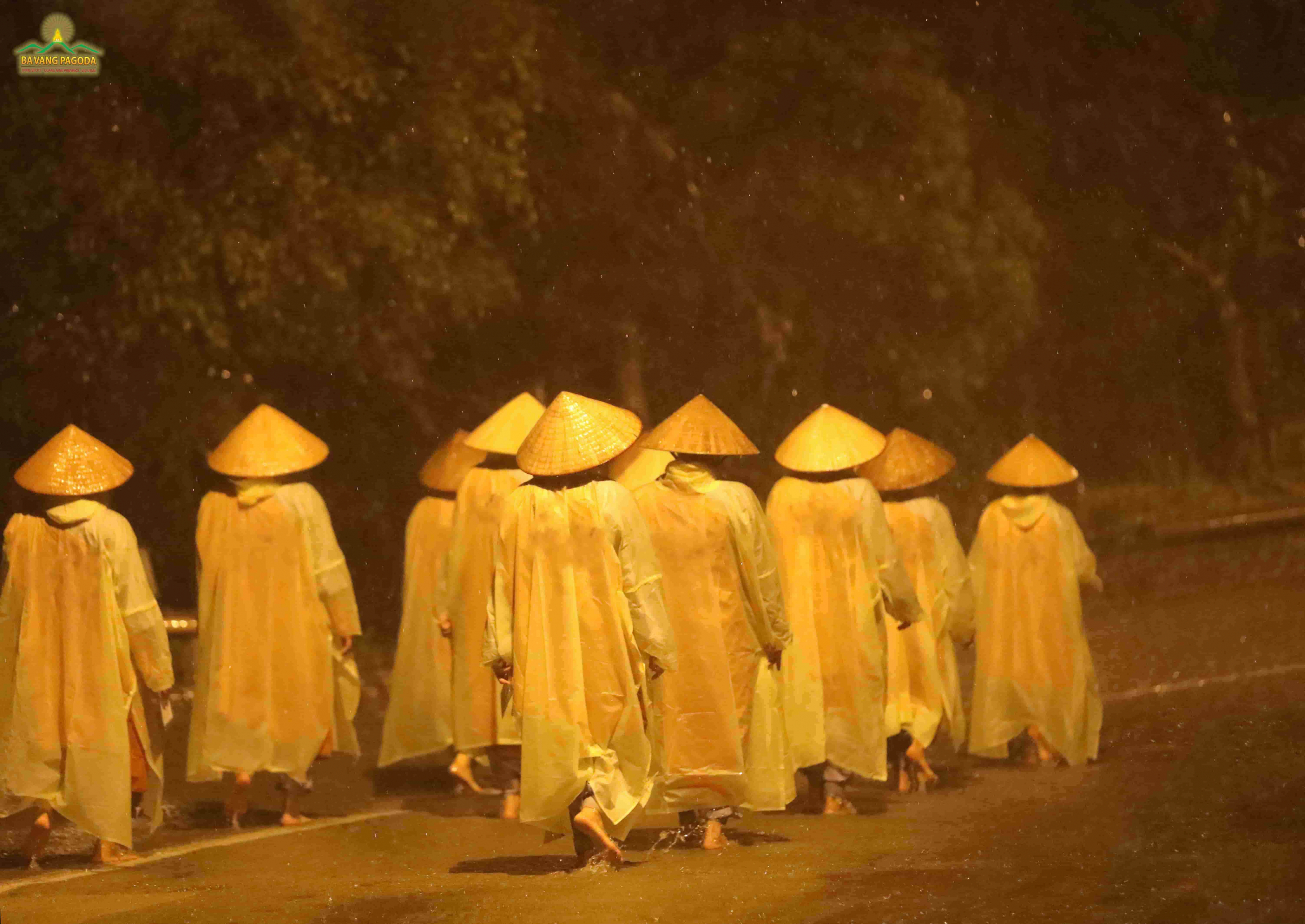 Nuns of Ba Vang Pagoda doing walking meditation in the pouring rain.
