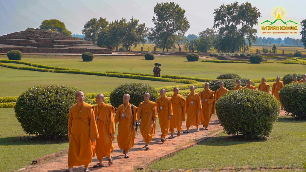 The Sangha of Ba Vang Pagoda walking meditation through the area near the Main Stupa in Piprahwa.