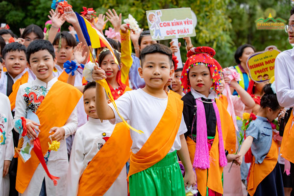 Juveniles and teenagers from Rahula Club in colorful clothes celebrating VESAK day