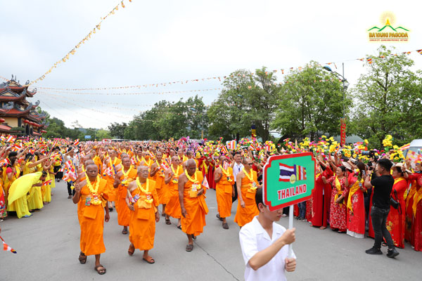 The Sangha from Thailand marching in the flower parade at Ba Vang Pagoda, Vietnam